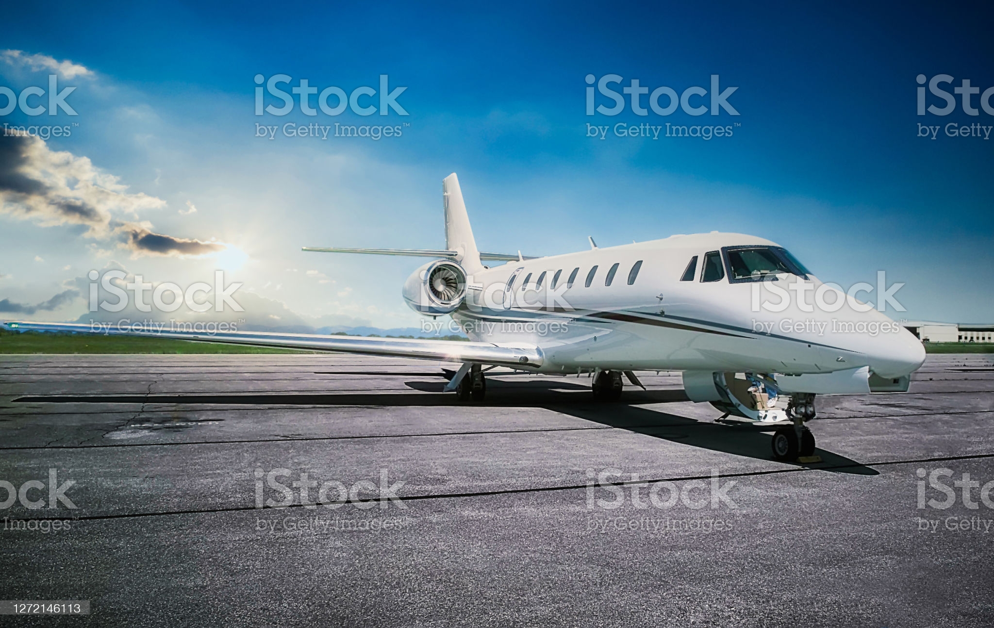 a-generic-white-jet-airplane-at-dawn-stockpack-istock
